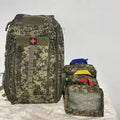 Camouflage backpack with smaller pouches on a white background