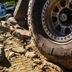 Off-road vehicle tire on a rocky terrain