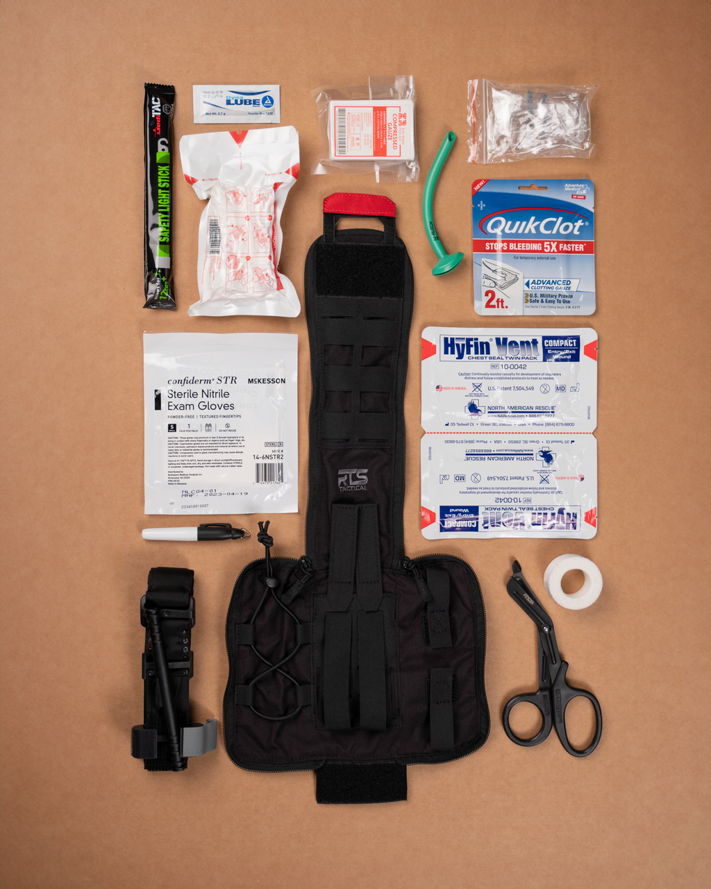 First aid kit components on a brown background