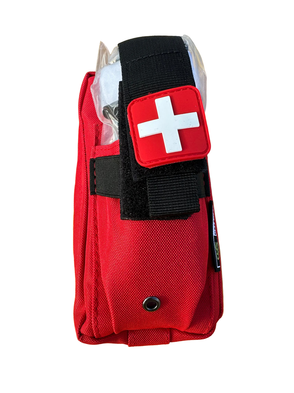 Red first aid kit with a white cross on a yellow surface