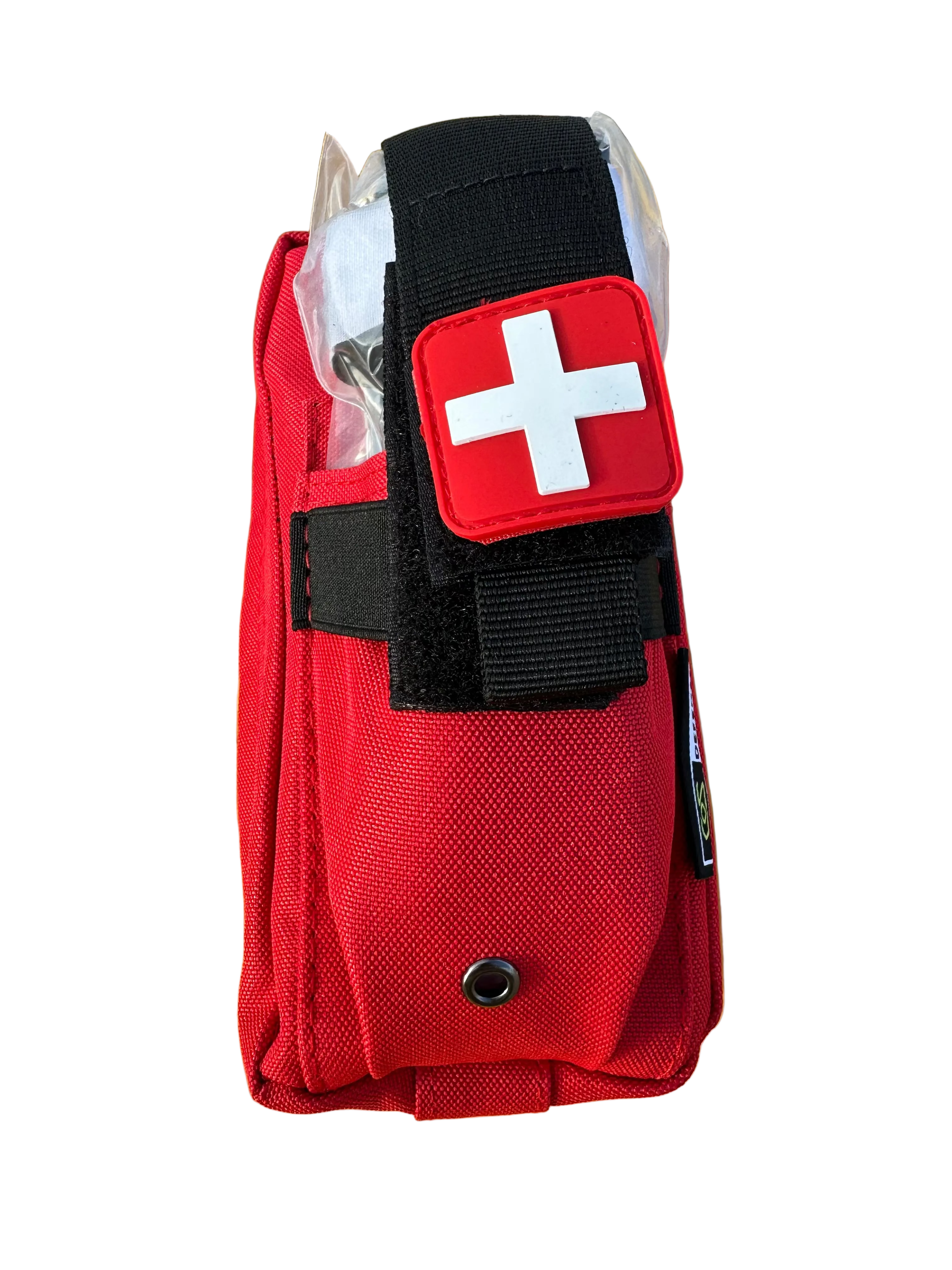 Red first aid kit with a white cross on a yellow surface