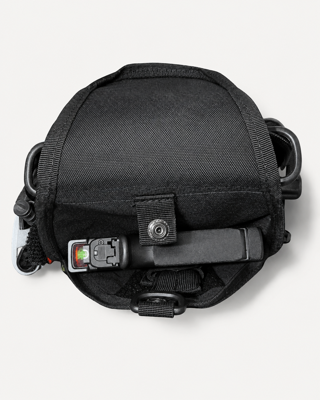 Top access view of the Level 1 Get Home Sling Bag integrated holster compartment. Firearm and ammunition are not included.